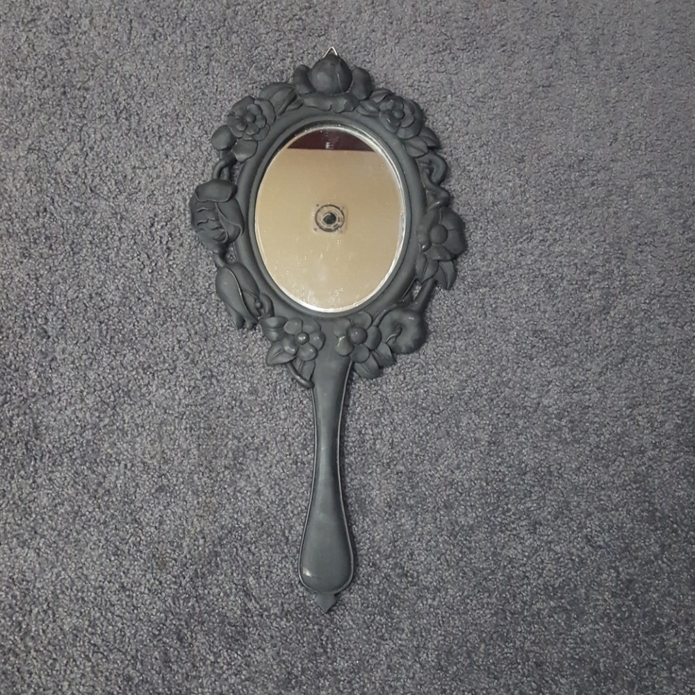 Hand held mirror hanging